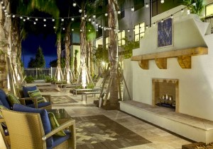 There is even an outdoor fireplace and also cabanas around the pool!